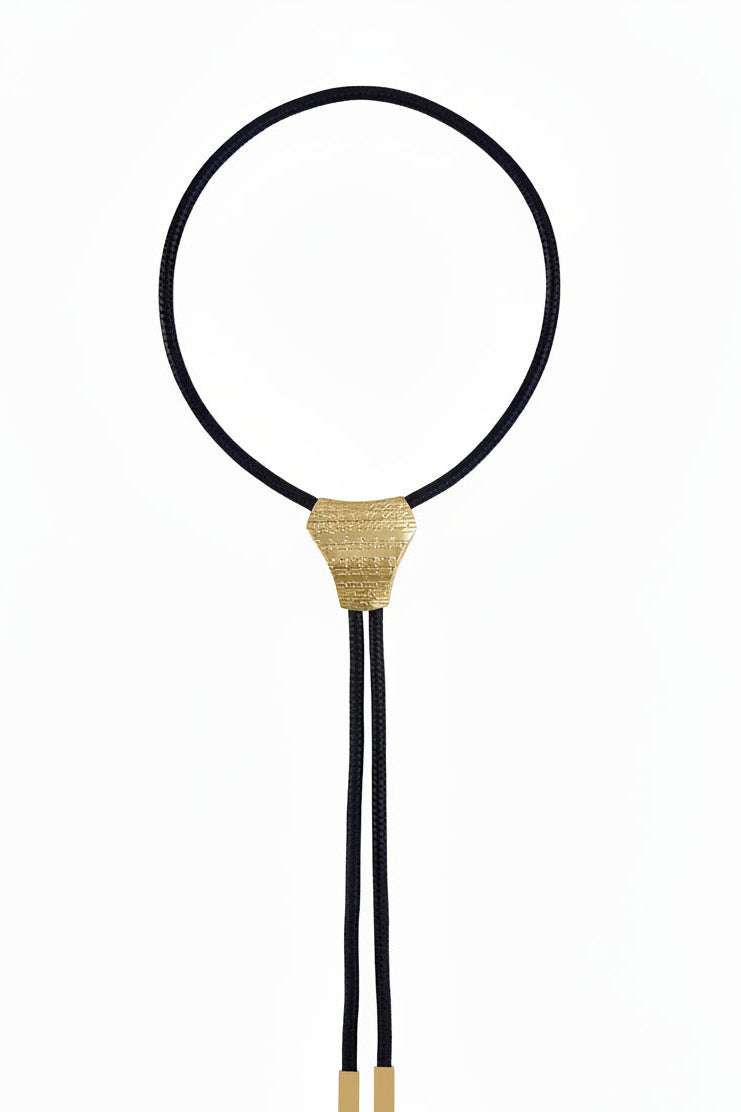 Black bolo tie with gold clasp on a white background