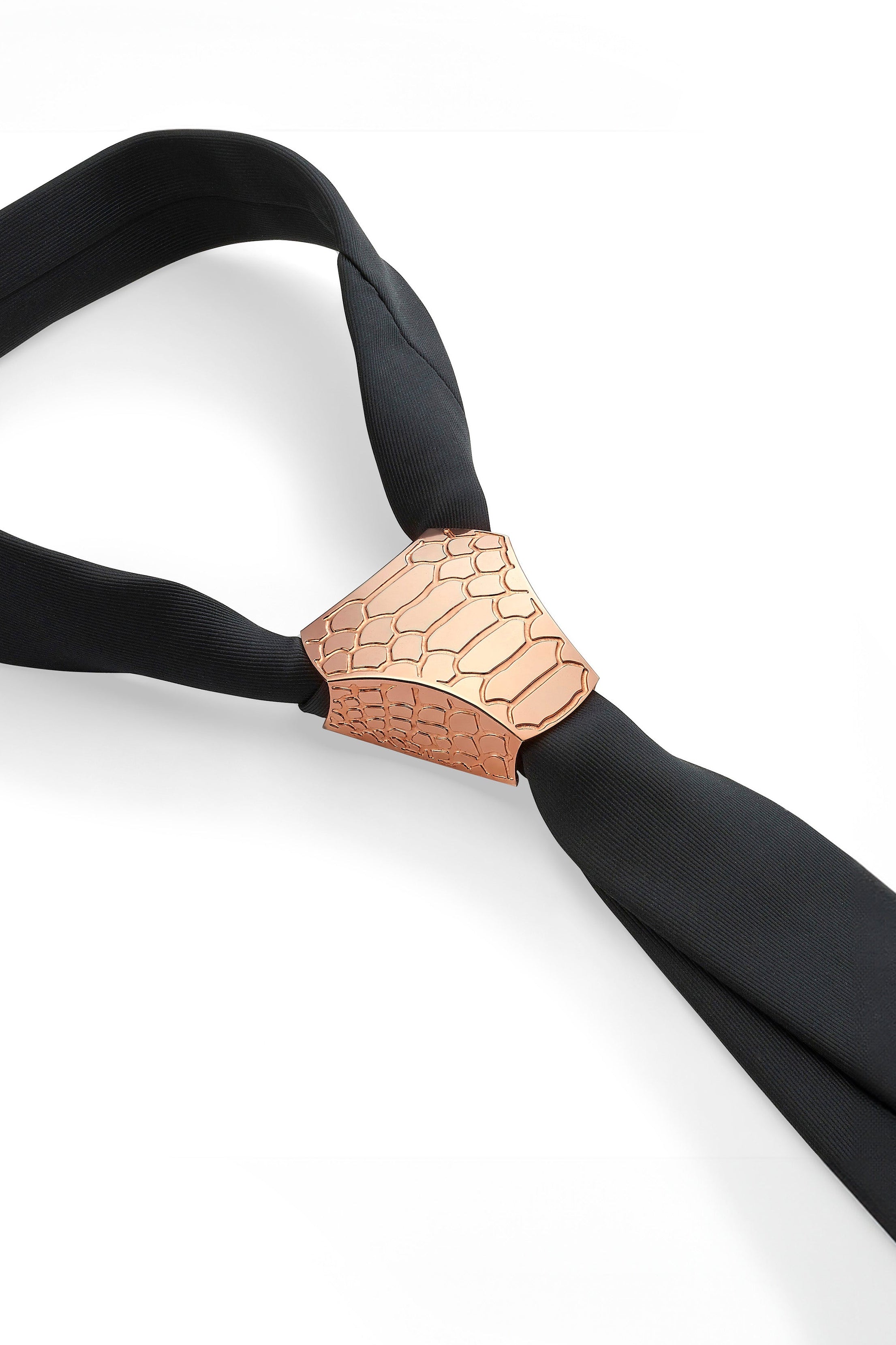 Black tie with a roise gold clasp on a white background