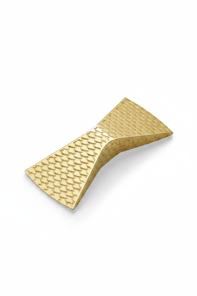 Gold textured belt buckle on a white background